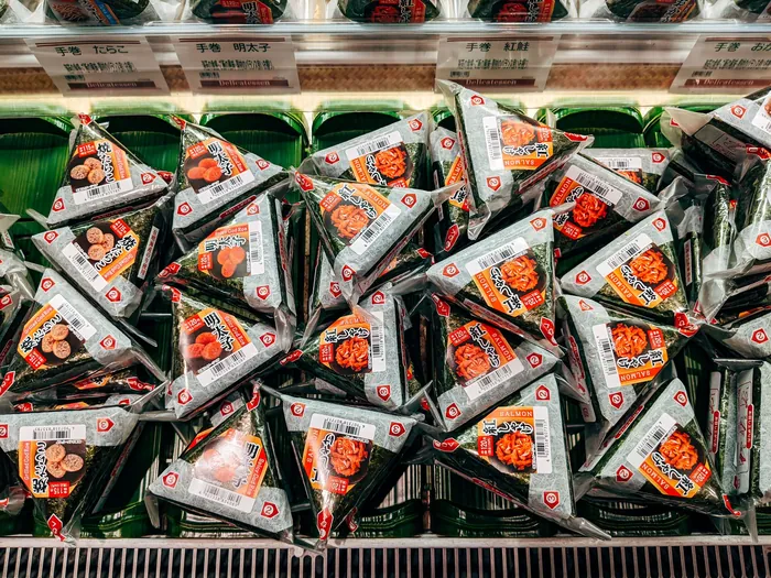 Packaged onigiri rice balls on a Japanese convenience store shelf