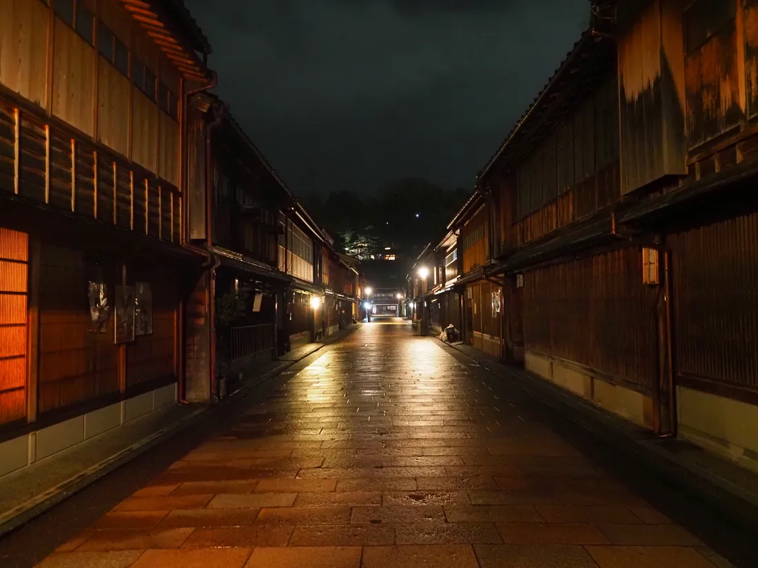 A quiet samurai-district street at night in Kanazawa