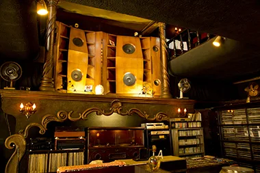 The wall of tall wooden speakers at Meikyoku Kissa Lion