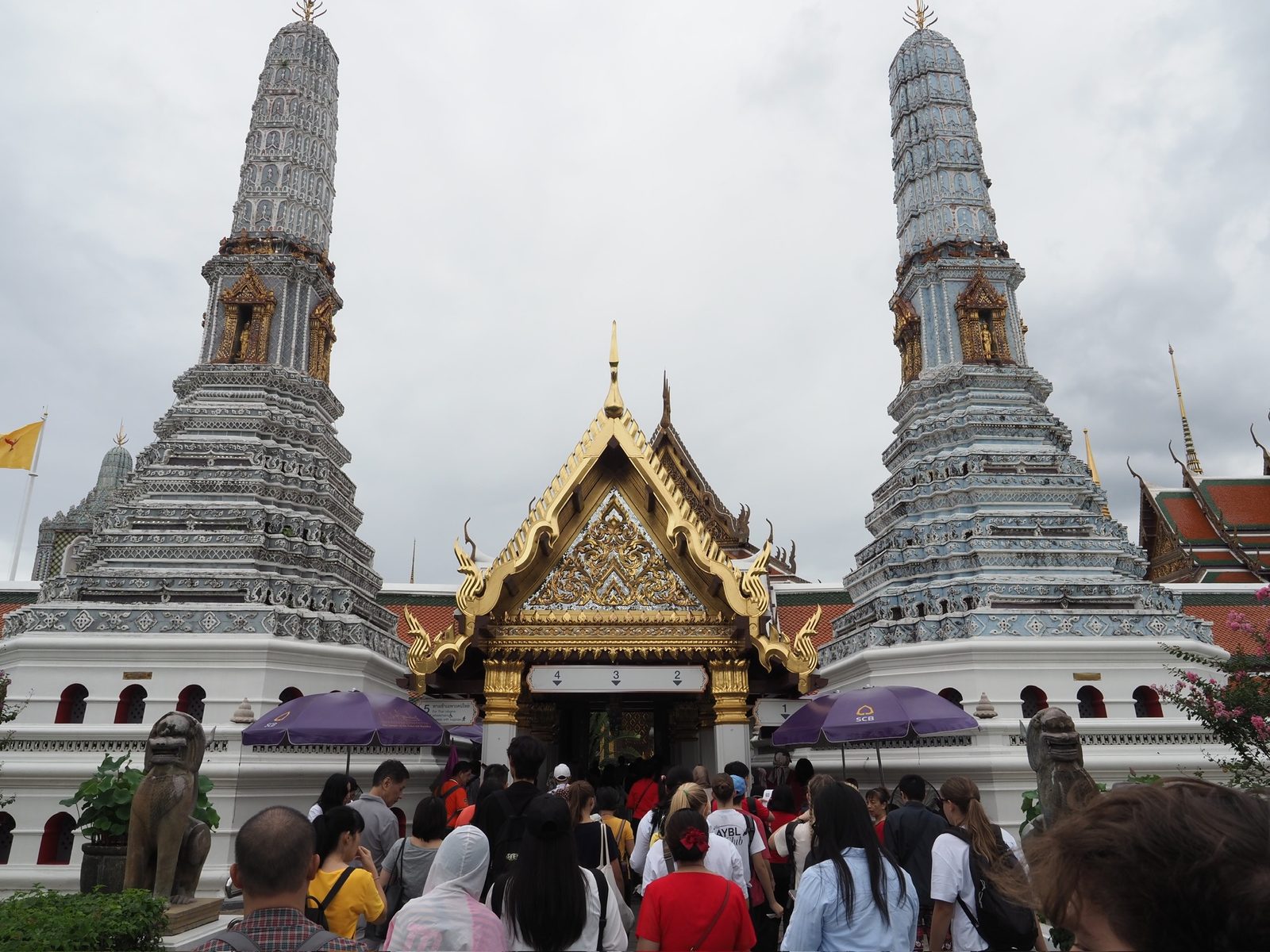 Grand multi-tiered temple complex in lush greenery and rainfall, Mae Hong Son Loop