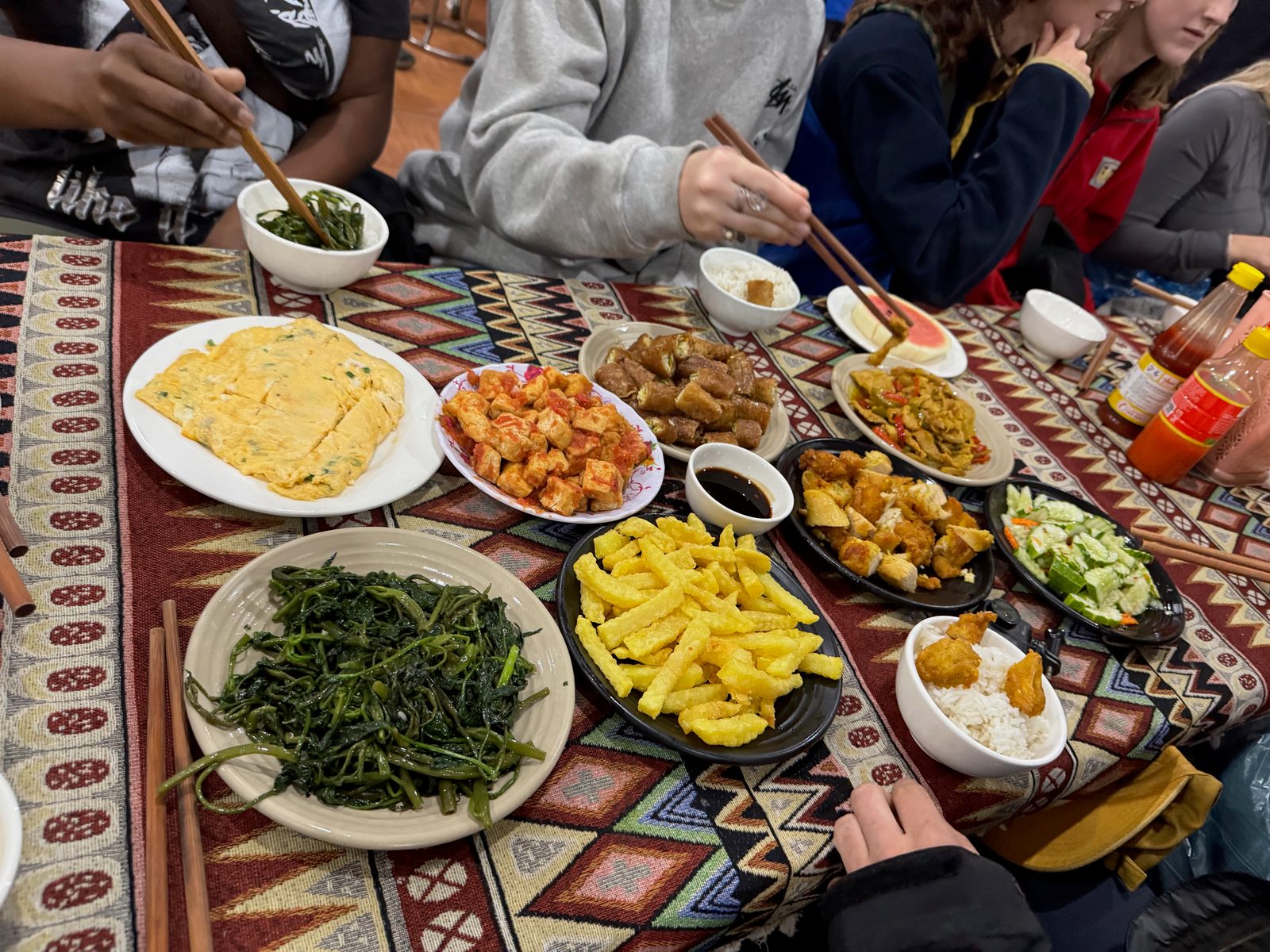 Communal dinner — dishes spread across the table