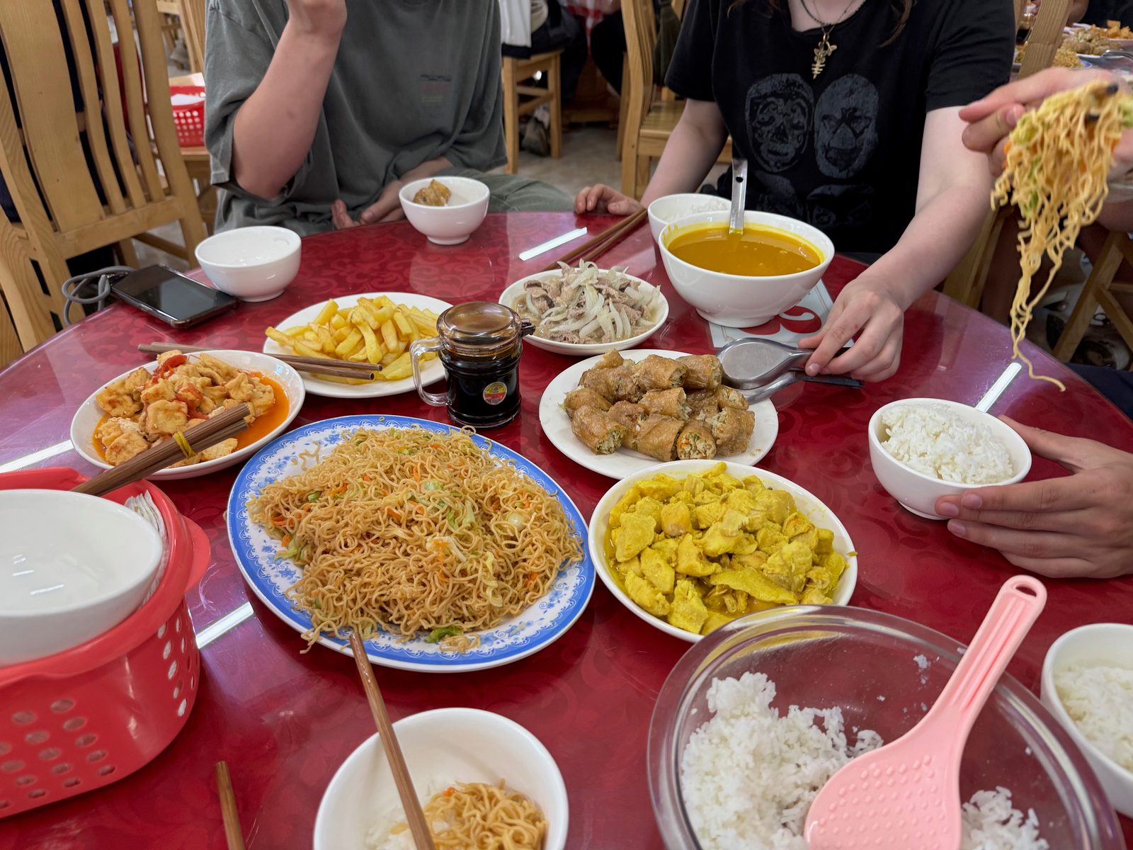 Table spread of Vietnamese dishes somewhere on the Hà Giang Loop